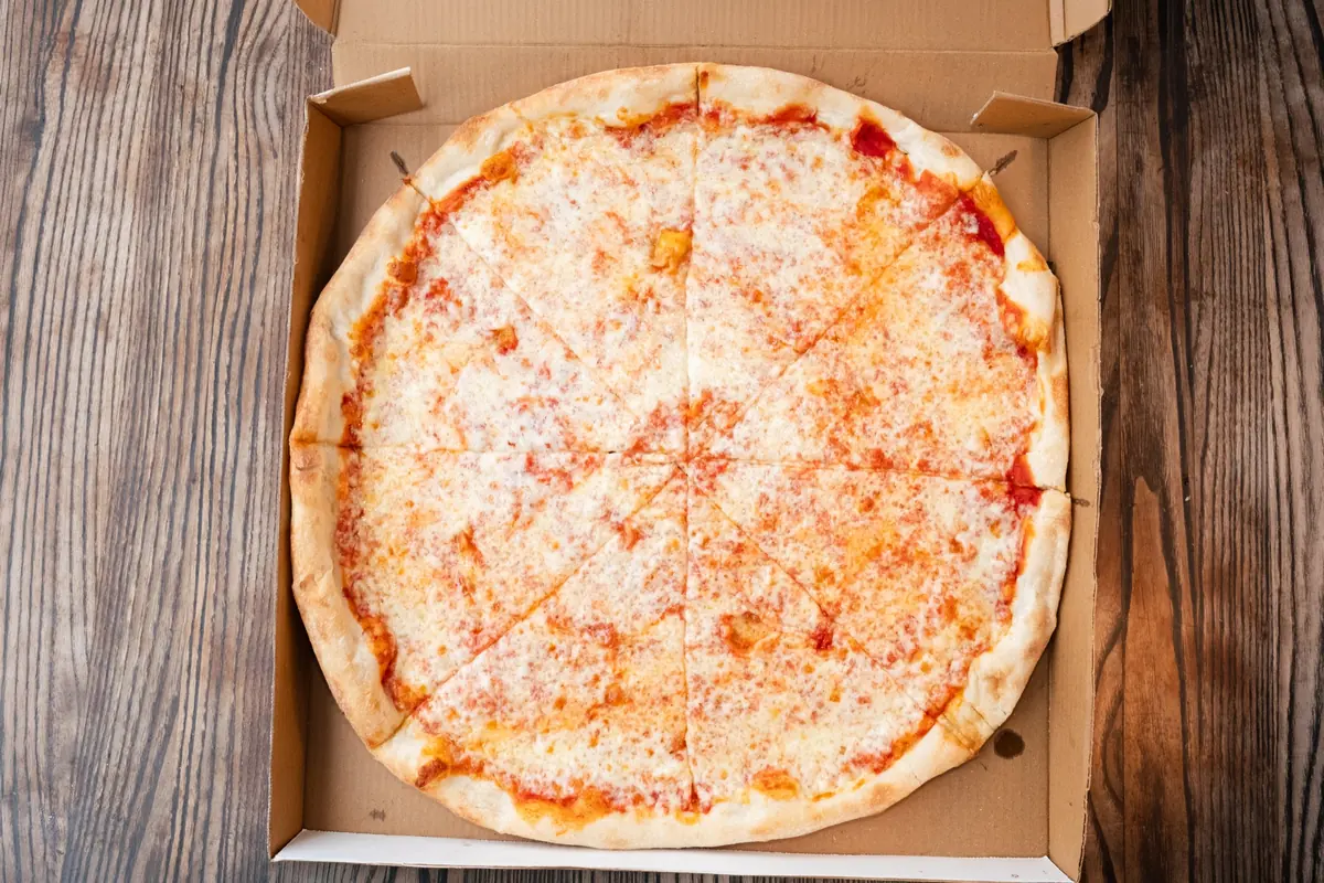 Whole cheese pizza pie in a box