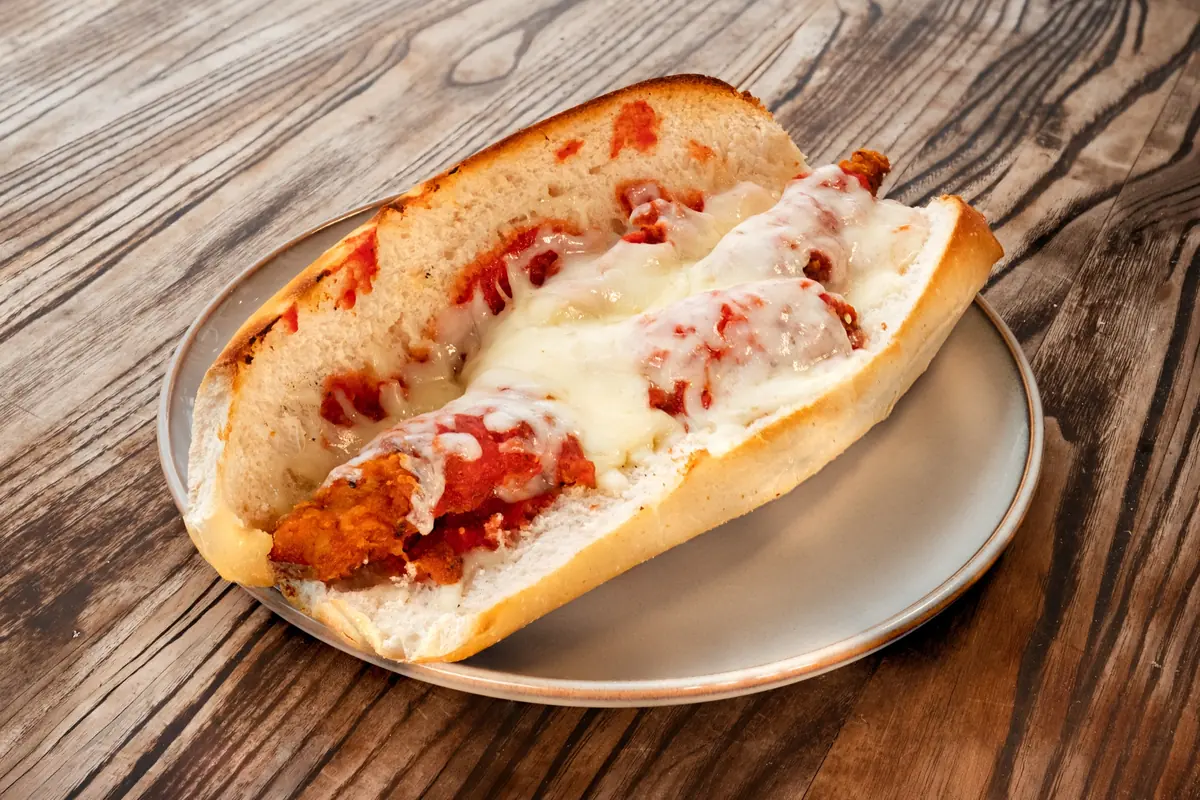 Chicken cutlet parm hero on a plate