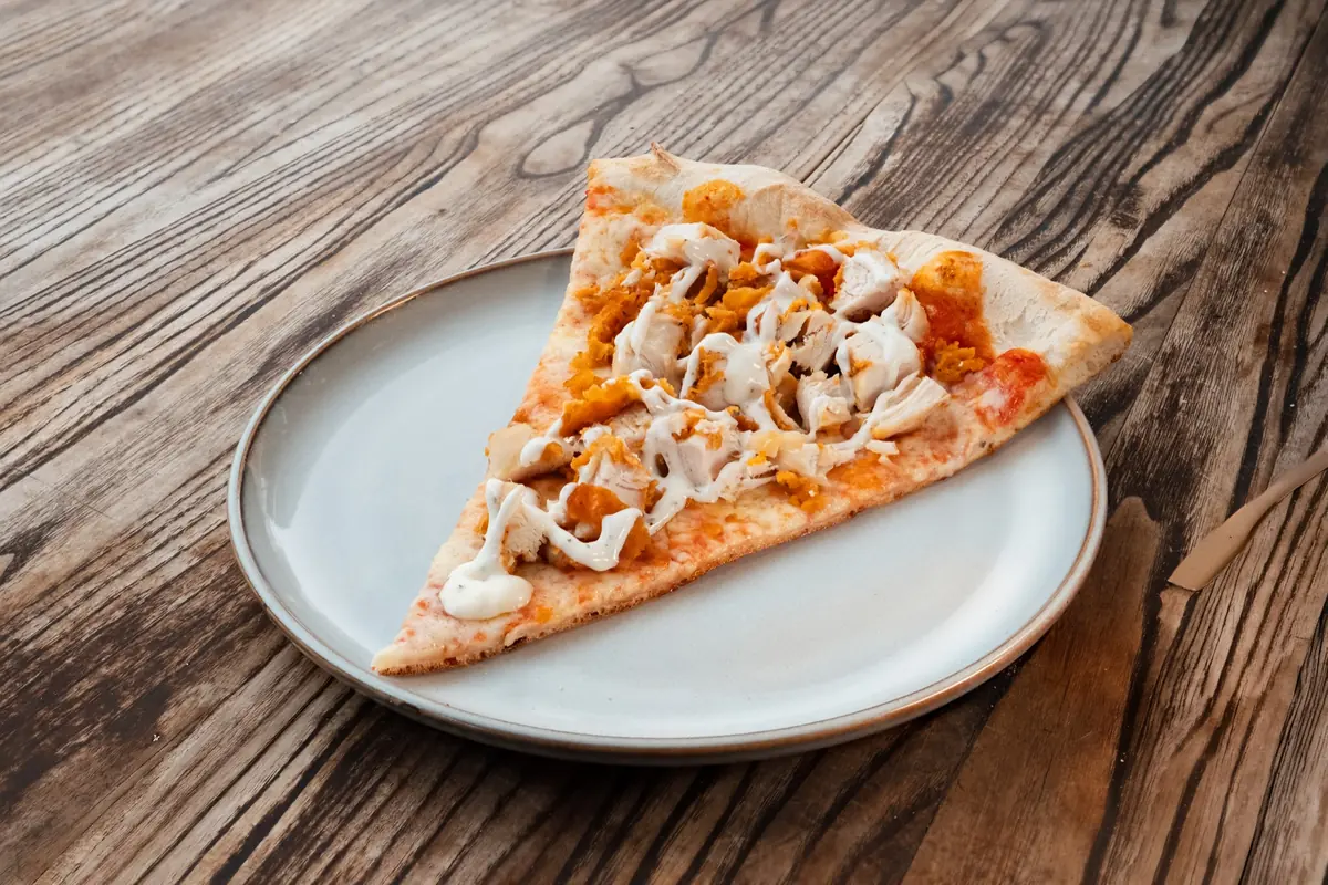 Chicken ranch pizza slice