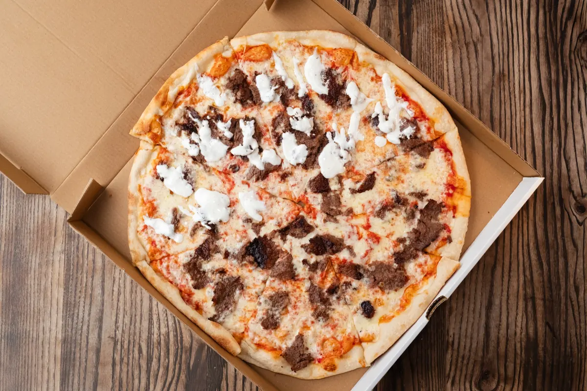 Whole lamb gyro pizza pie in a box