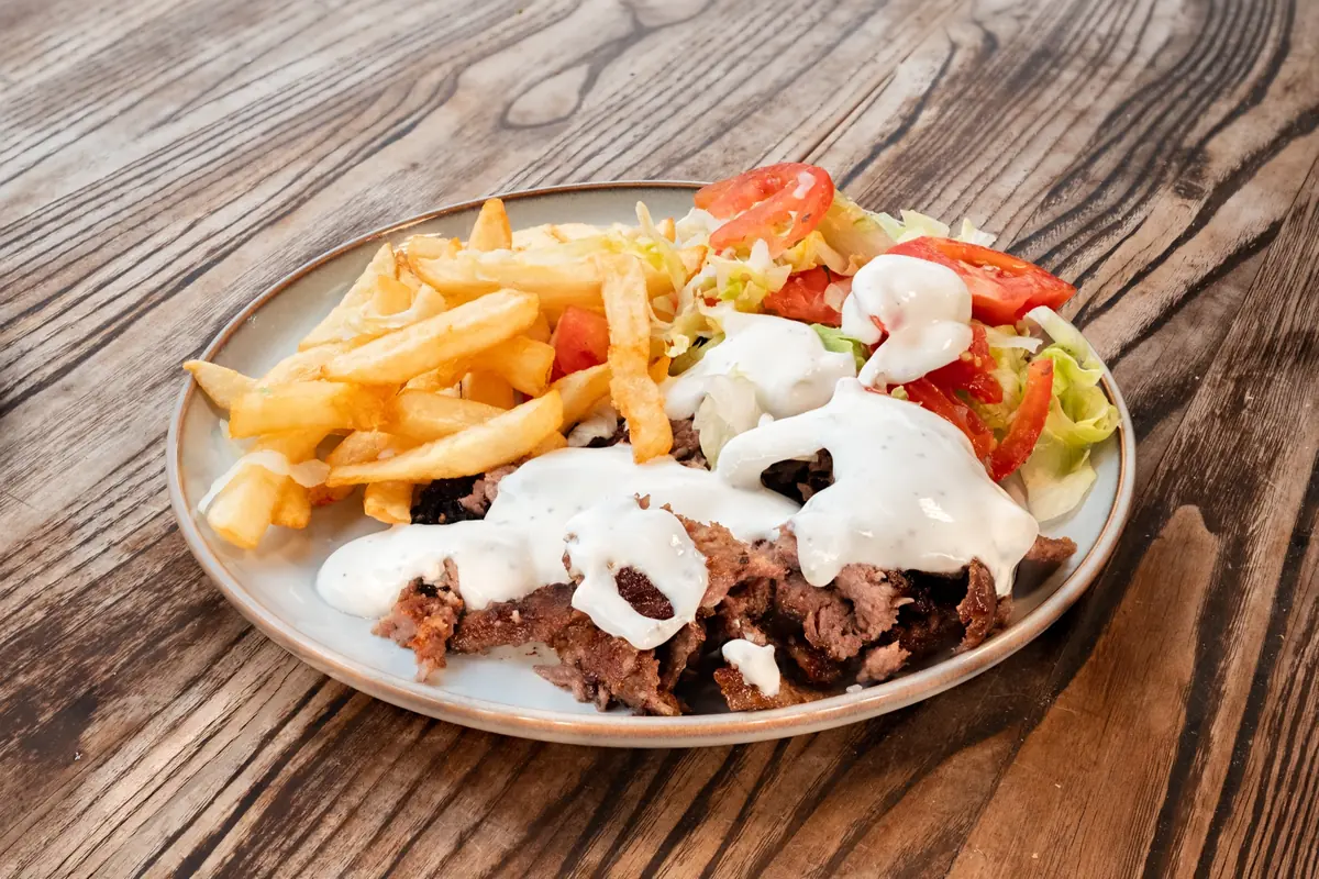 Lamb gyro platter with fries, salad and white sauce