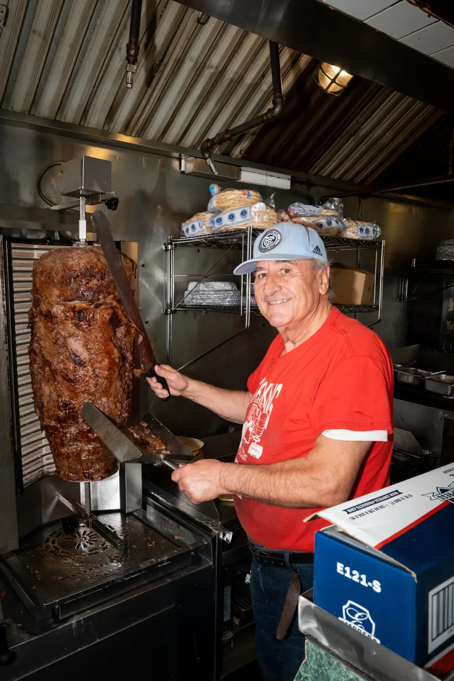 The owner carving the gyro spit