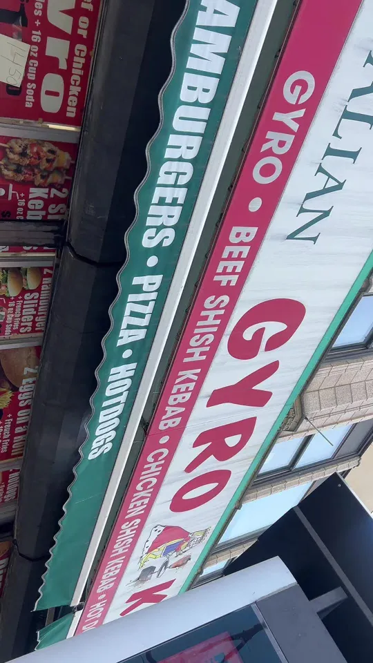 The Gyro King sign listing gyro, shish kebab, pizza and hot dogs